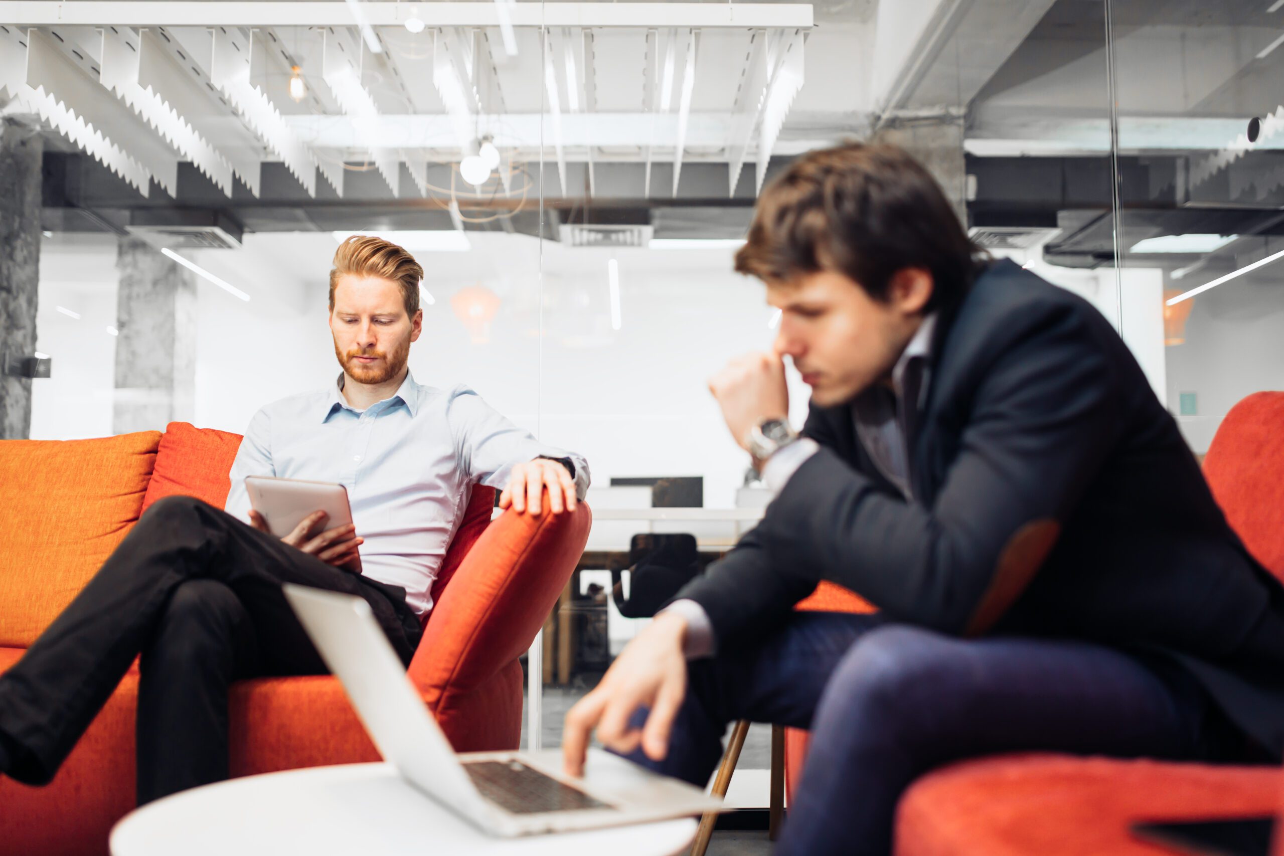 Business people looking at their devices
